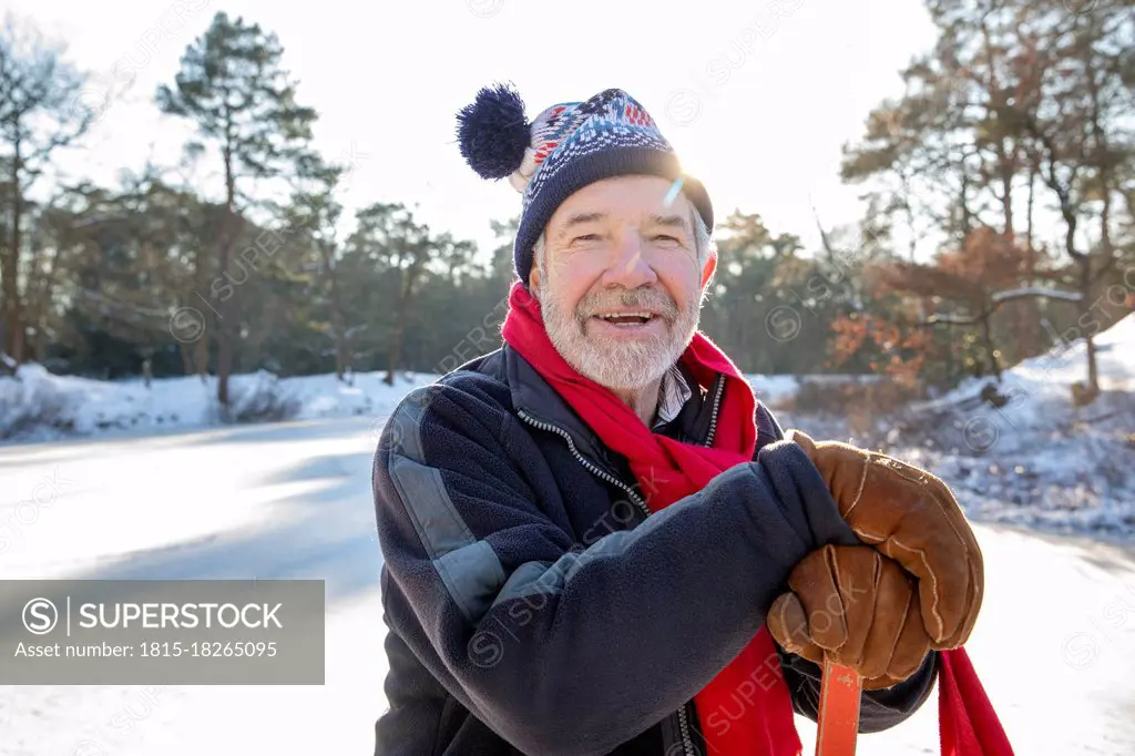 Man with knit hat on snow during sunny day