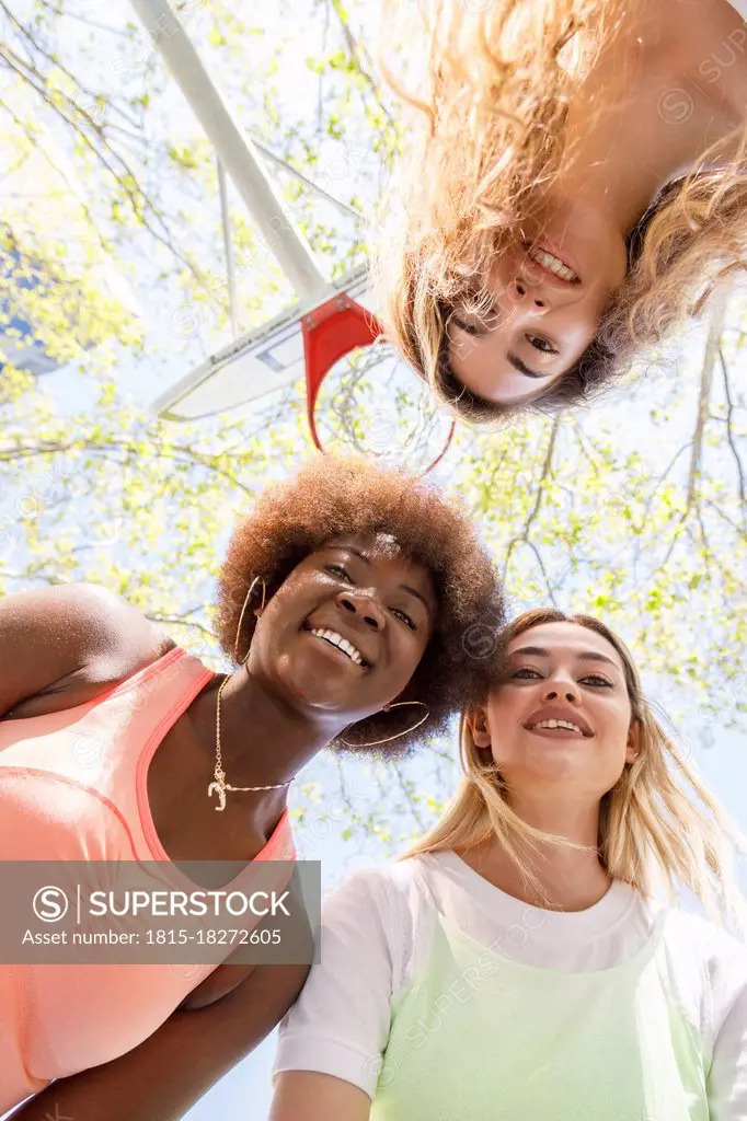 Young women smiling at sports court