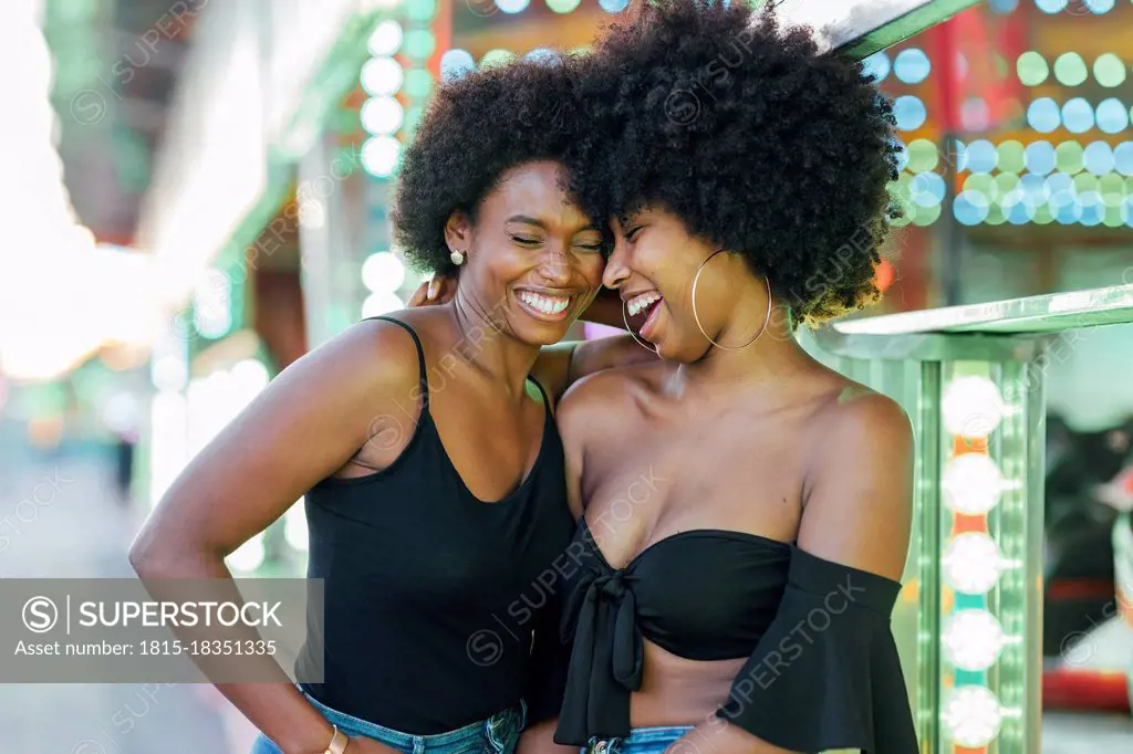 African female friends standing in park