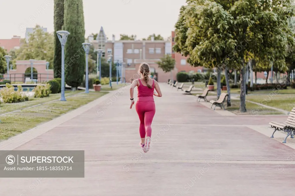 Active female athlete running in park