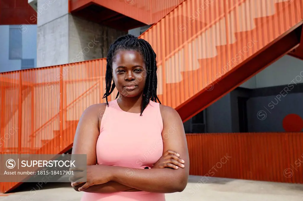 Young woman with arms crossed