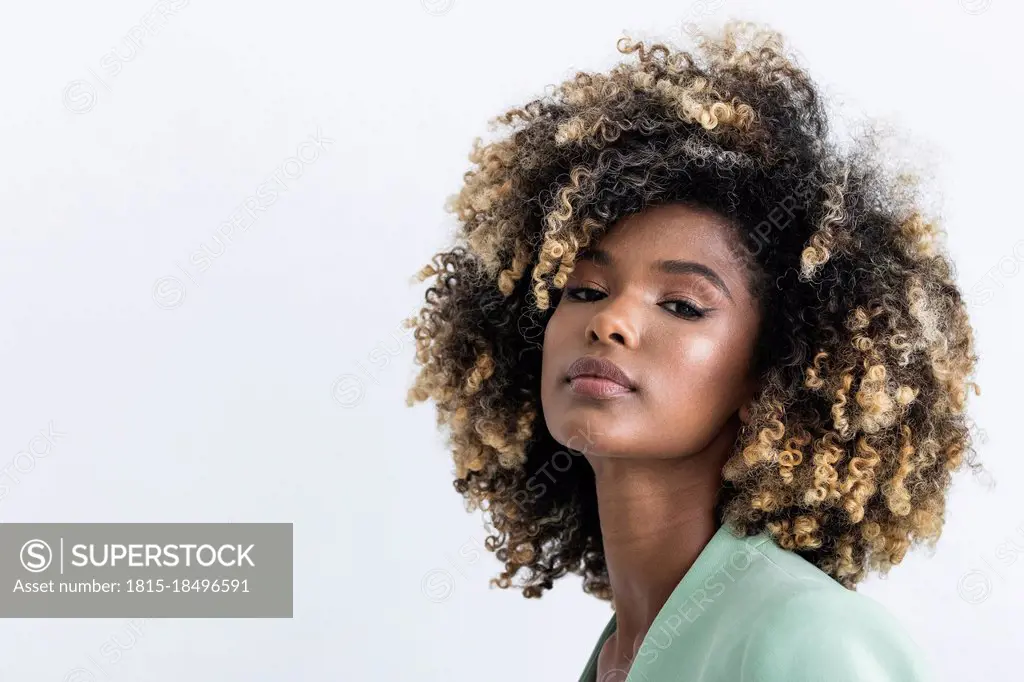 Young businesswoman with highlights hair in studio