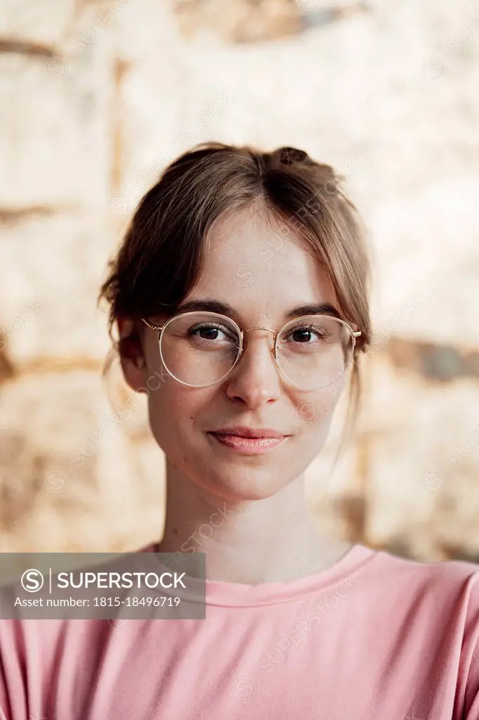 Woman with brown hair wearing eyeglasses