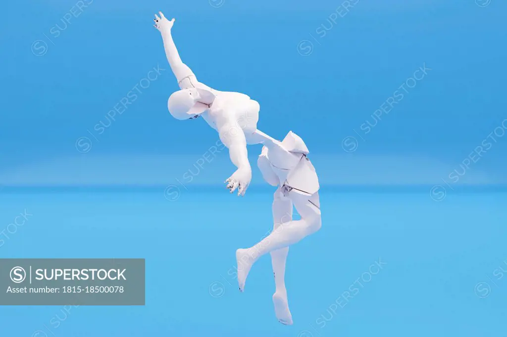 Three dimensional render of¶ÿbroken human figure falling down against blue background