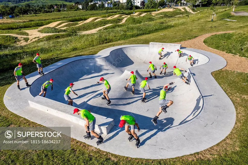 Multiple image of male athlete inline skating at skatepool on sunny day