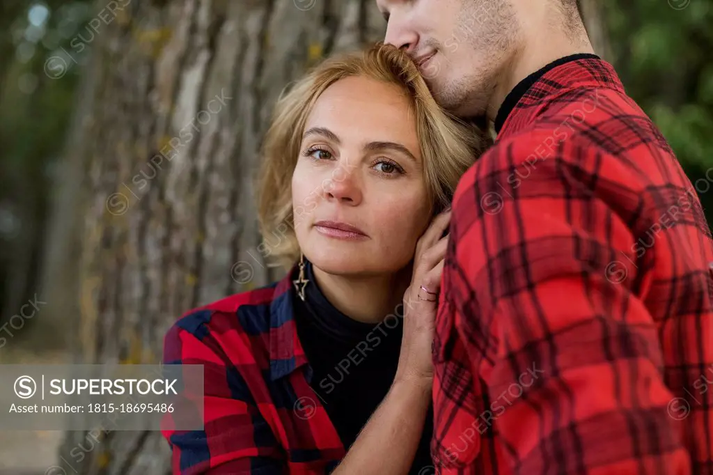 Blond mature woman embracing boyfriend