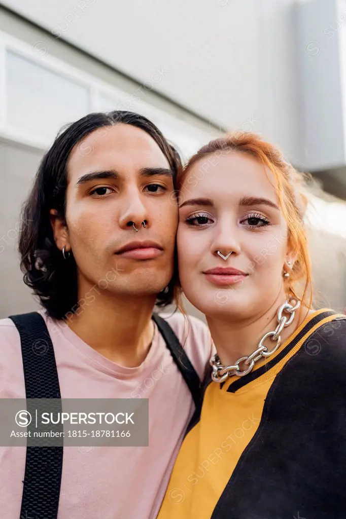 Smiling woman cheek to cheek with friend