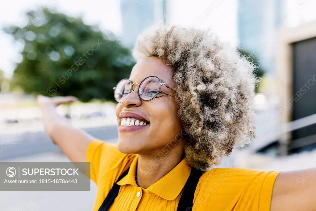 Carefree woman with arms outstretched