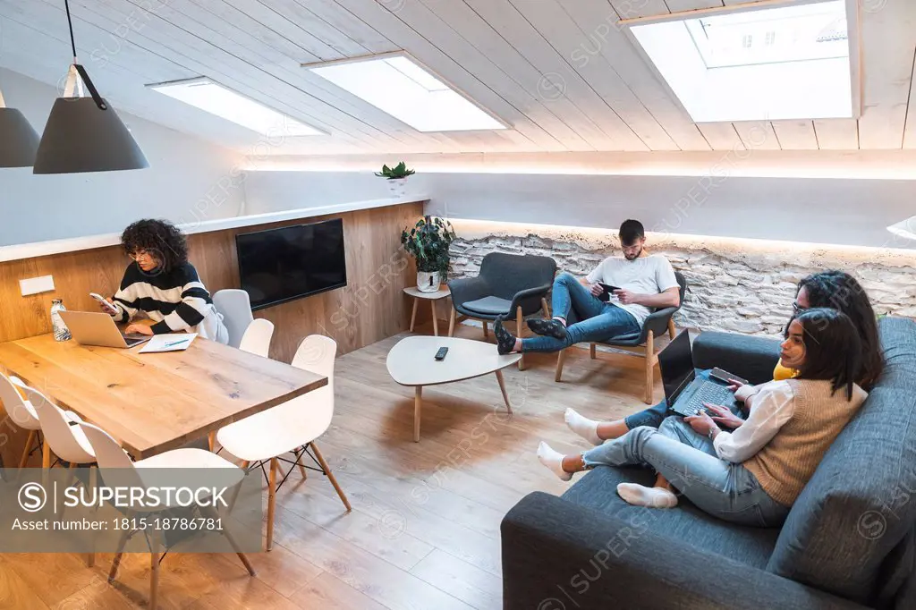 Businesswoman and colleagues working at coworking office