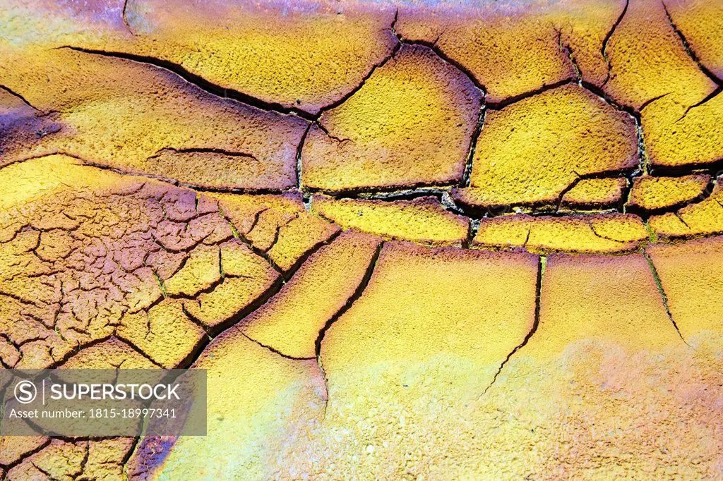 Full frame of dry cracked soil on bank of Rio Tinto