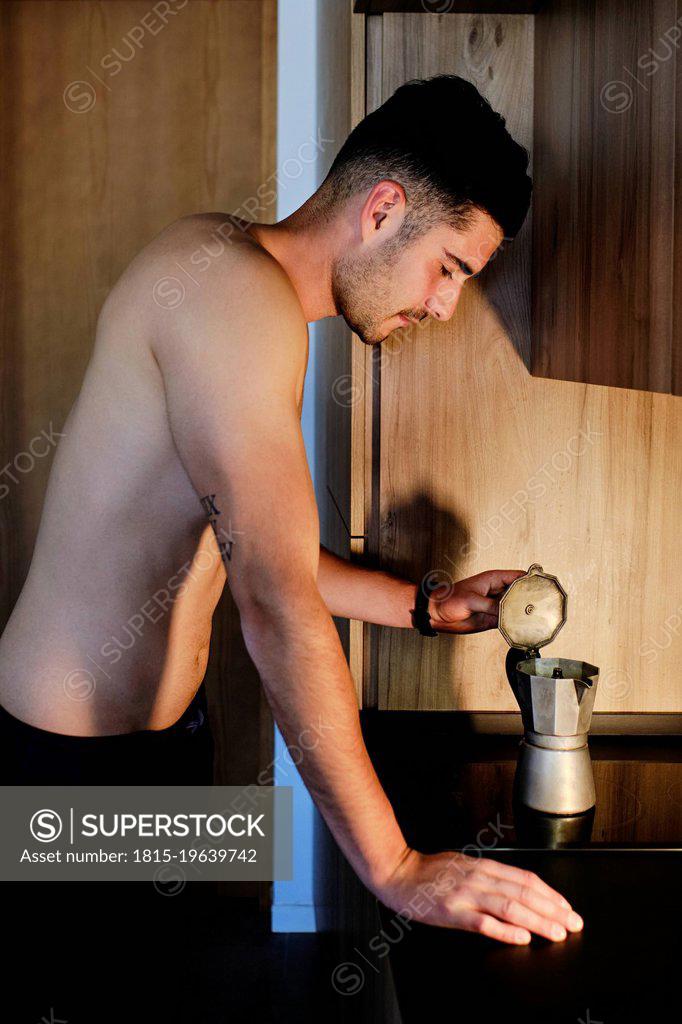 Man serving coffee from a moka pot Stock Photo by ©nito103 117806646