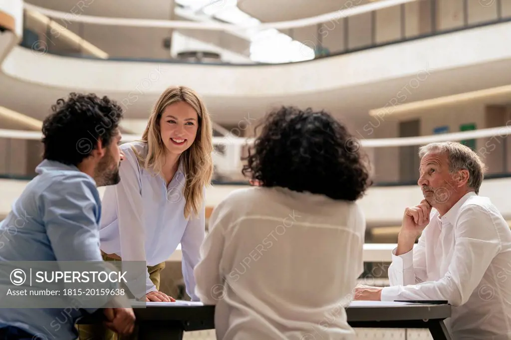 Multiracial business colleagues discussing strategy in meeting