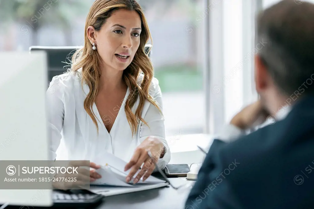 Business colleagues discussing in office