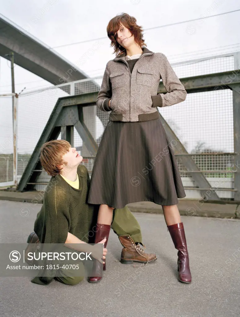 Man kneeling in front of woman