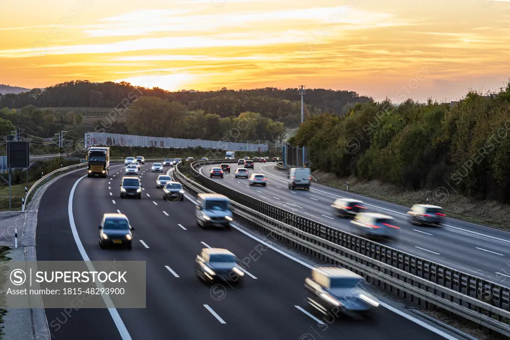 Germany, Baden-Wurttemberg, Kirchheim unter Teck, Traffic on Bundesautobahn 8 at sunset