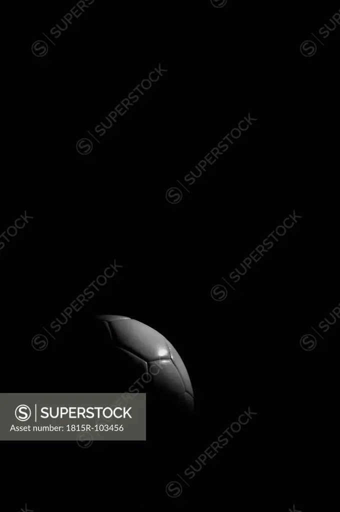 Soccer ball on black background