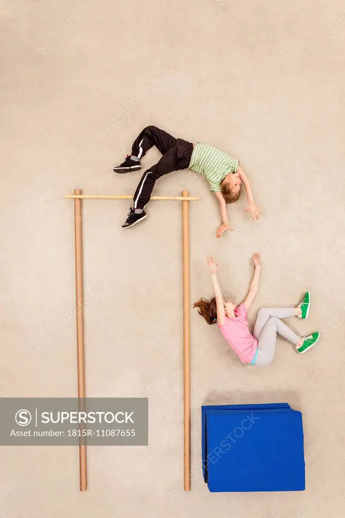 Children training high jump