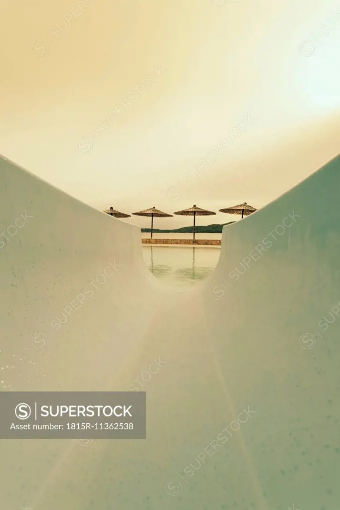 Croatia, Sibenik, Sunshades, Swimming pool of a hotel facility, Evening mood