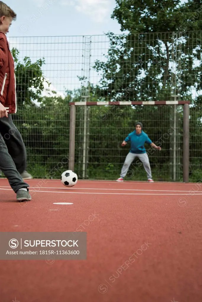 Two boys playing soccer