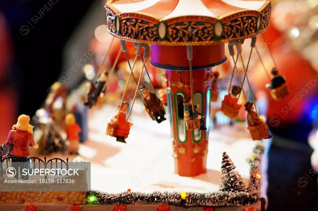 Germany, Illuminated toy roundabout for christmas decoration, close up