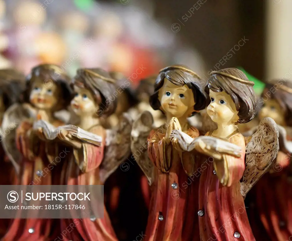 Germany, Christmas decoration with pairs of angel figurines reading book