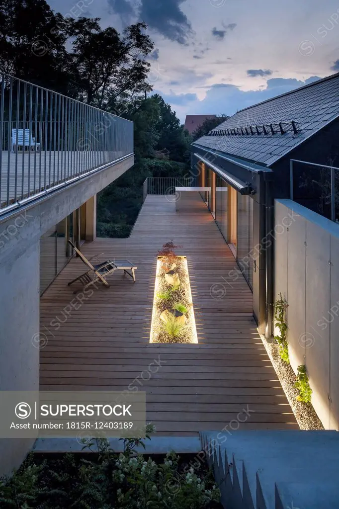 One family house, wooden terrace in the evening