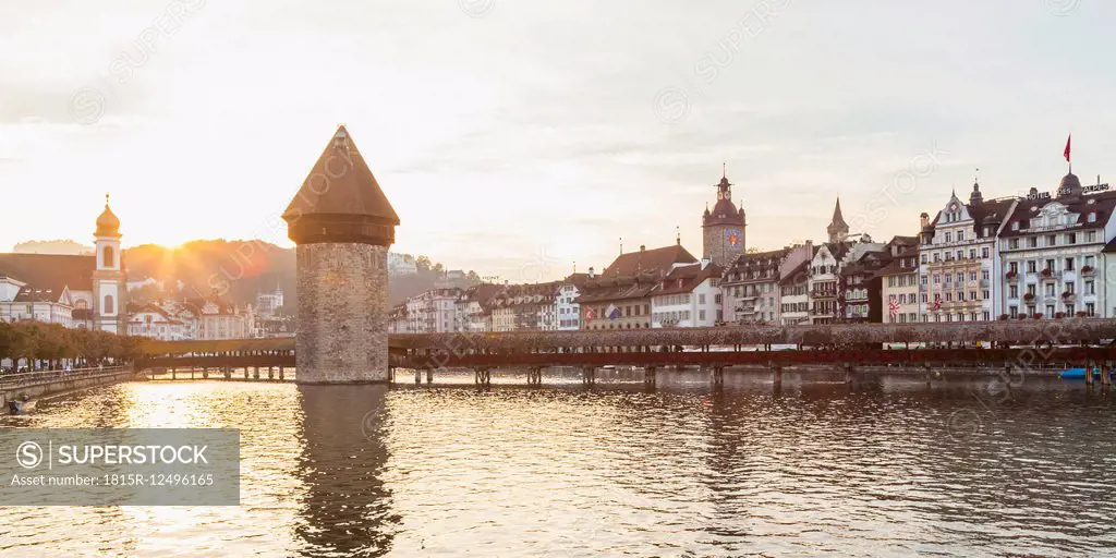 Switzerland, Canton of Lucerne, Lucerne, Old town, Reuss river, Chapel bridge and water tower at sunset