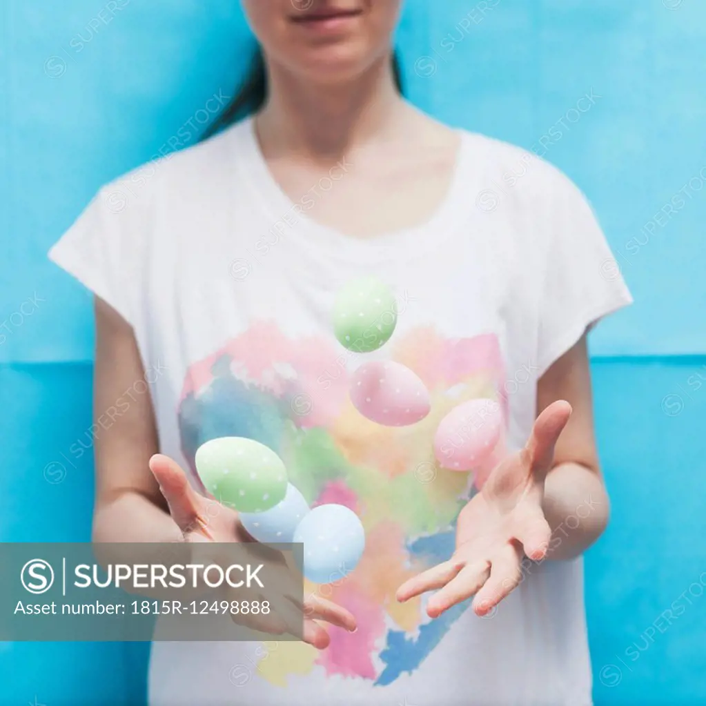 Woman throwing Easter eggs