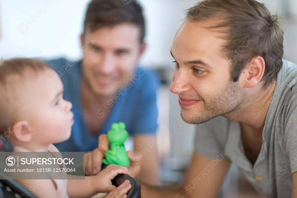 Gay couple with adopted child