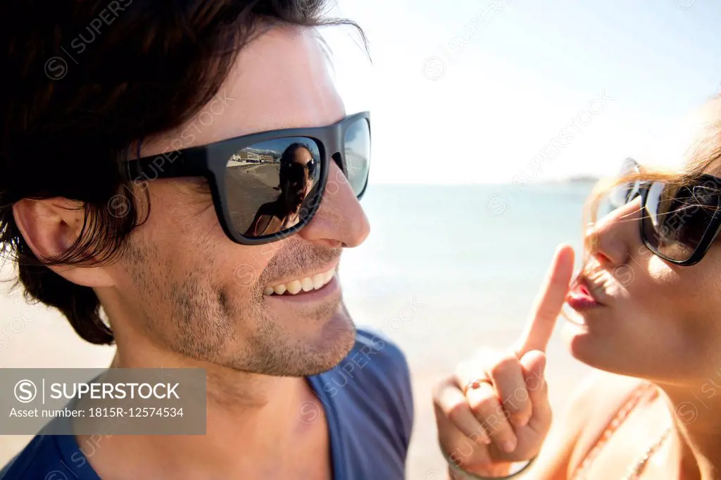 South Africa, portrait of happy couple wearing sunglasses