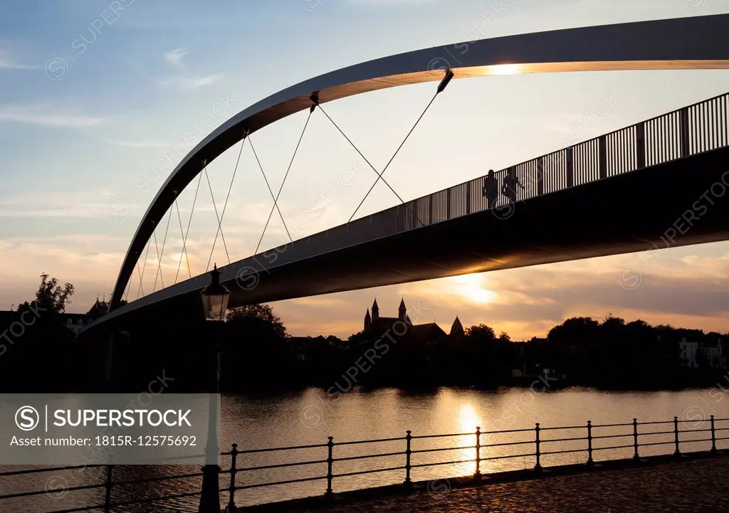 Netherlands, Maastricht, Meuse river and Hoge Brug at sunset