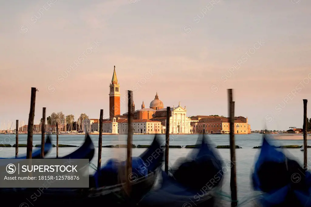 Italy, Venice, gondolas in front of San Giorgio Maggiore at dusk