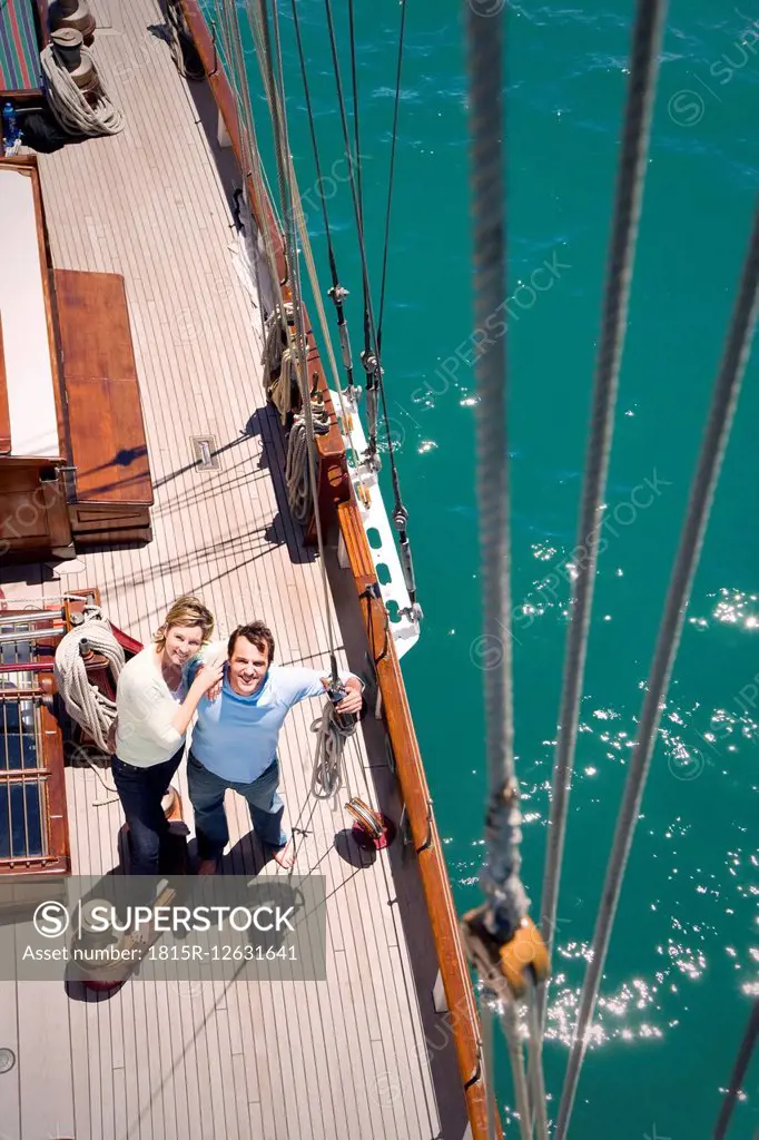 Mature couple on deck of a sailing ship