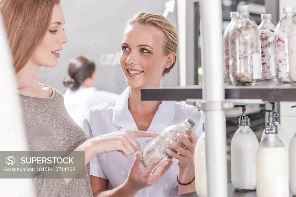 Client and shop assistant talking in wellness shop