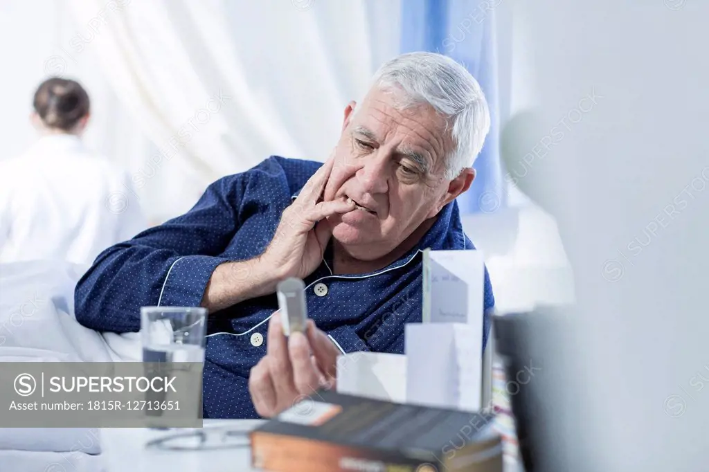 Patient in hospital taking medication