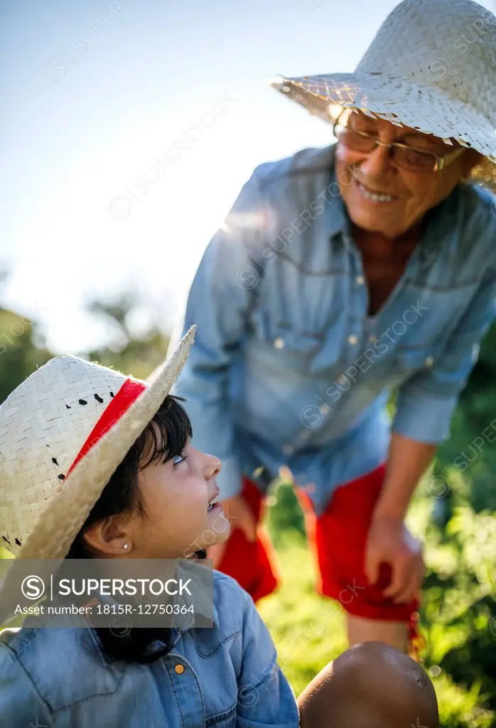 Senior woman and her granddaughter in the garden