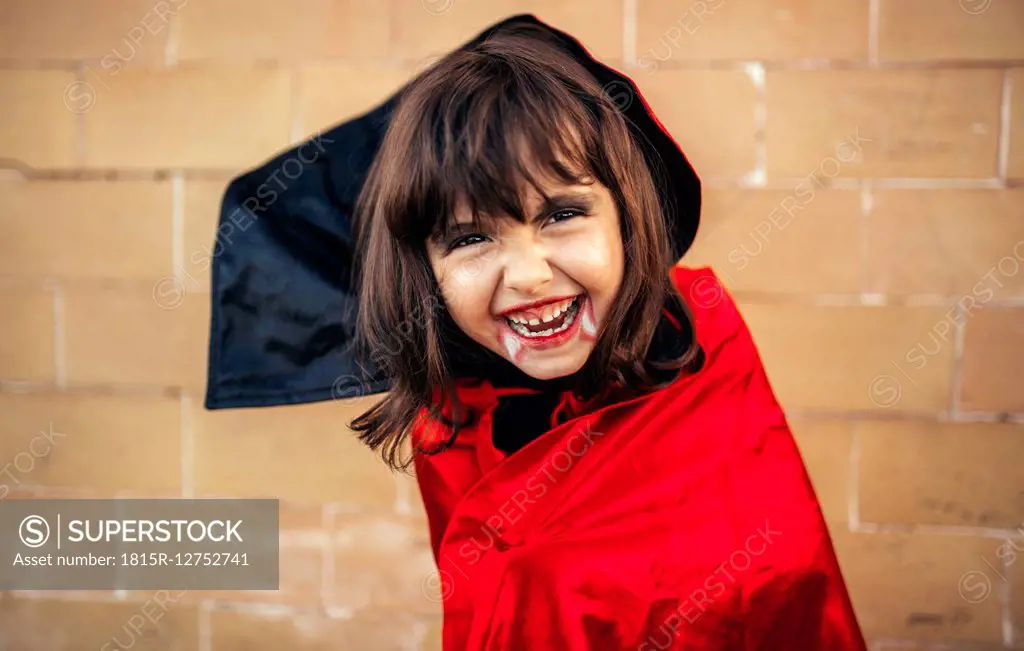 Portrait of little girl masquerade as vampire