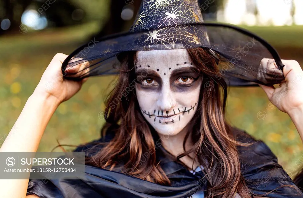 Portrait of masquerade girl at Halloween