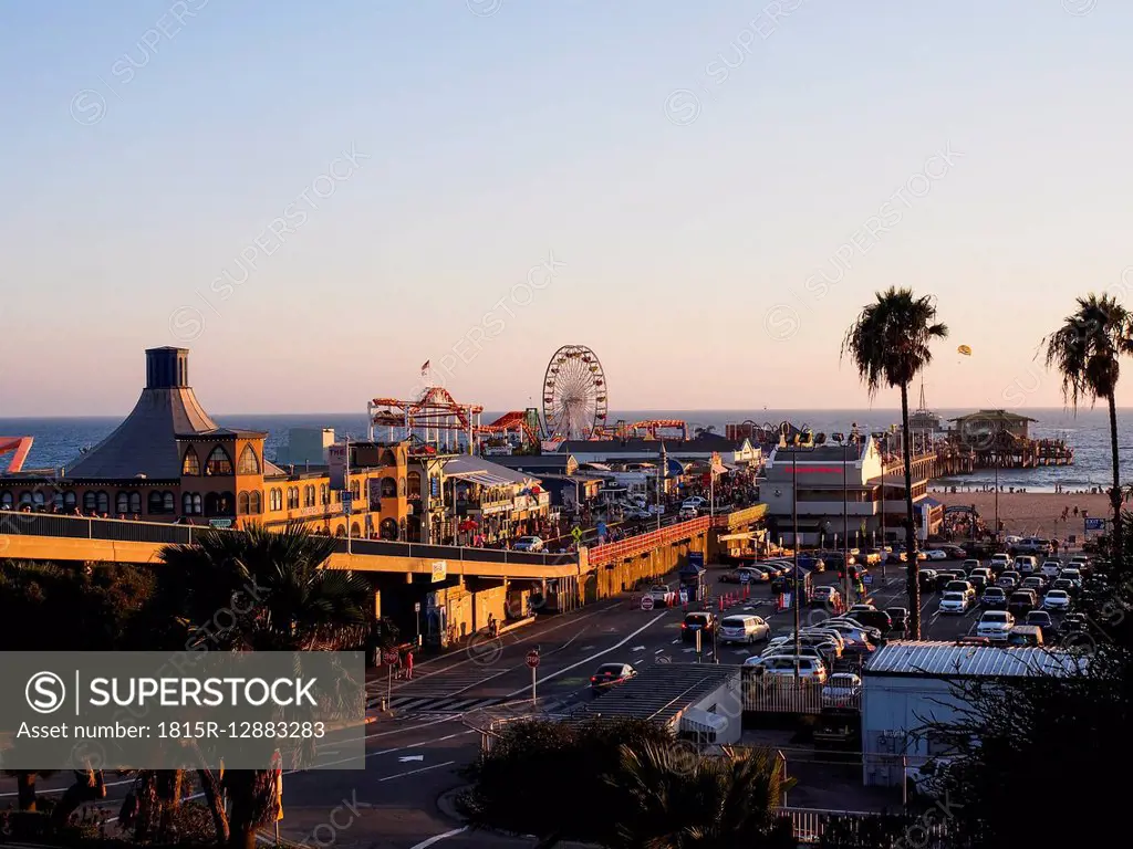 USA, Los Angeles, Santa Monica Beach Pier and Pacific Park at sunset