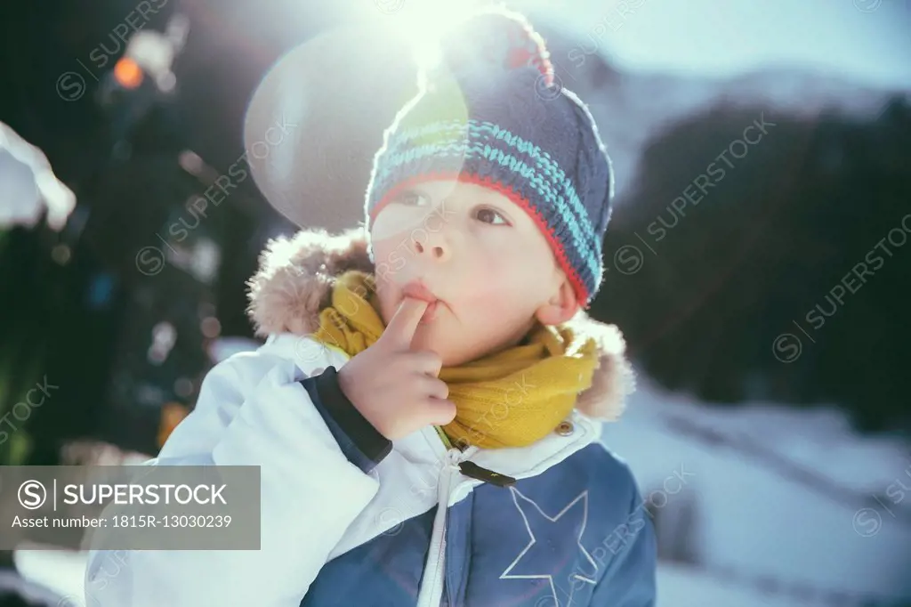 Italy, Val Venosta, Slingia, boy eating snow