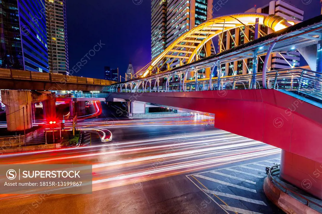 Thailand, footbridge and traffic in Bangkok at night