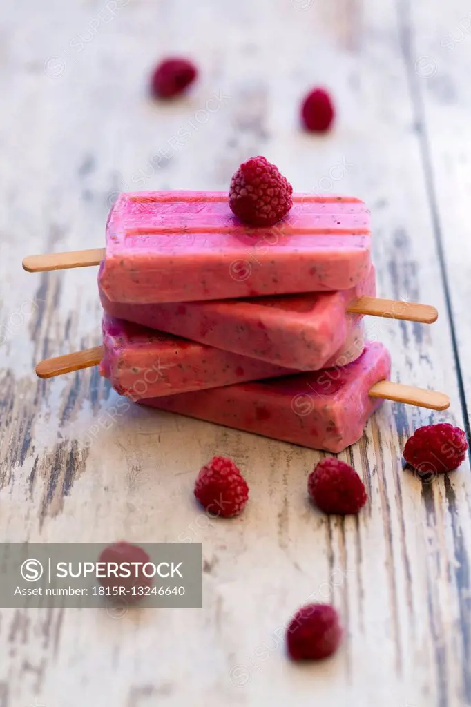 Stack of homemade raspberry ice lollies