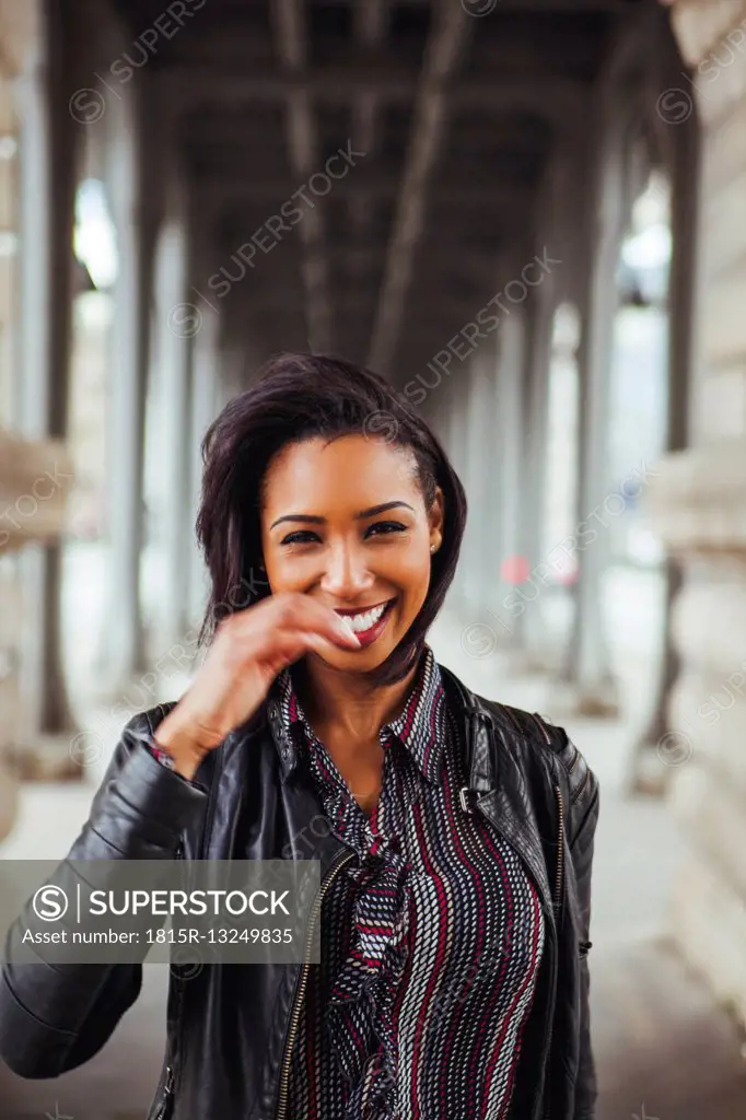 France, Paris, portrait of smiling young woman