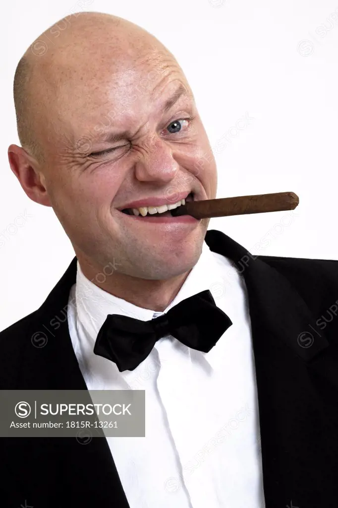 Man smoking cigar, portrait, tilt view