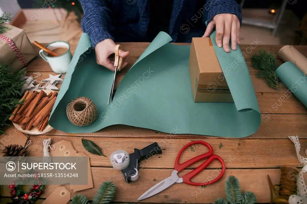 Woman wrapping christmas gifts