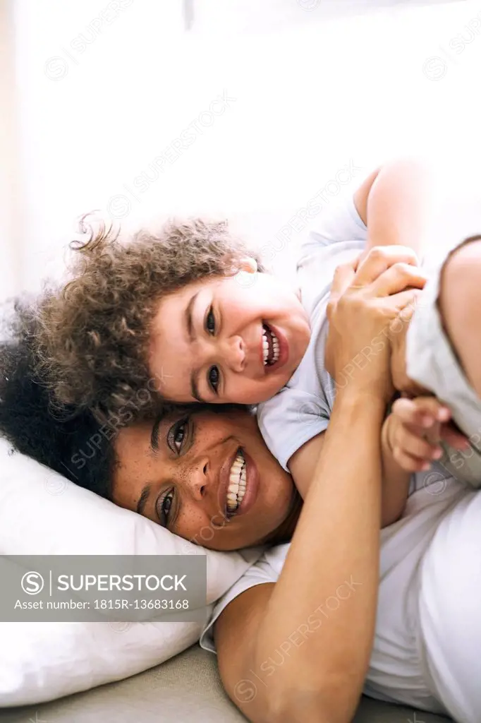 Portrait of mother and little son having fun together