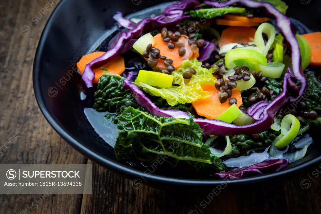 Bowl of vegan cabbage stew with lentils, partial view