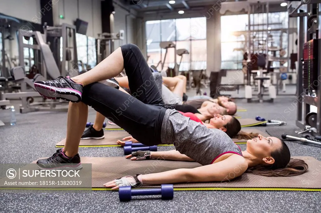 Group of athletes exercising in gym