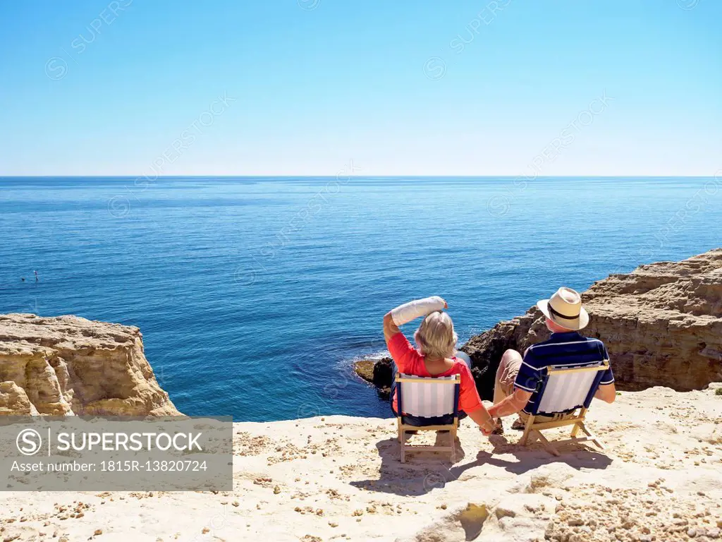 Spain, Andalusia, Cabo de Gata, back view of couple looking at the sea