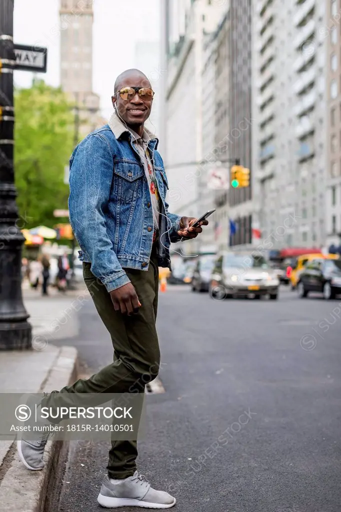 USA, New York City, Manhattan, portrait of stylish man in the city